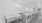 a white table and a white table in a room with a white wall
