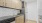 a kitchen with white cabinets