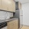 a kitchen with white cabinets