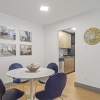 a dining room with a table and chairs