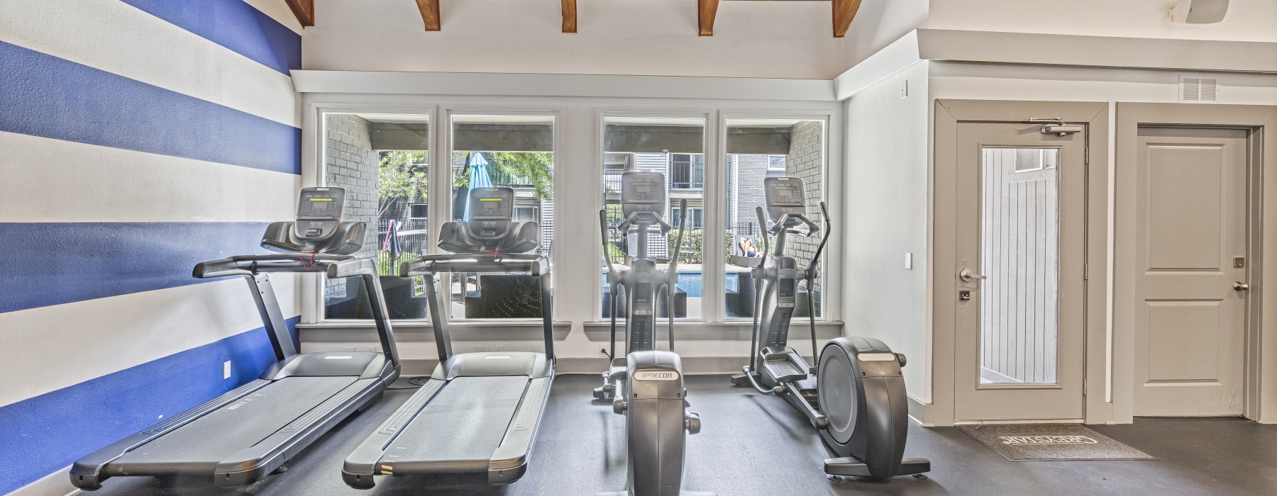 fitness center with cardio machines