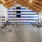 a room with a few wheelchairs and a blue wall with a white and black striped wall