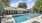 a swimming pool outside a house